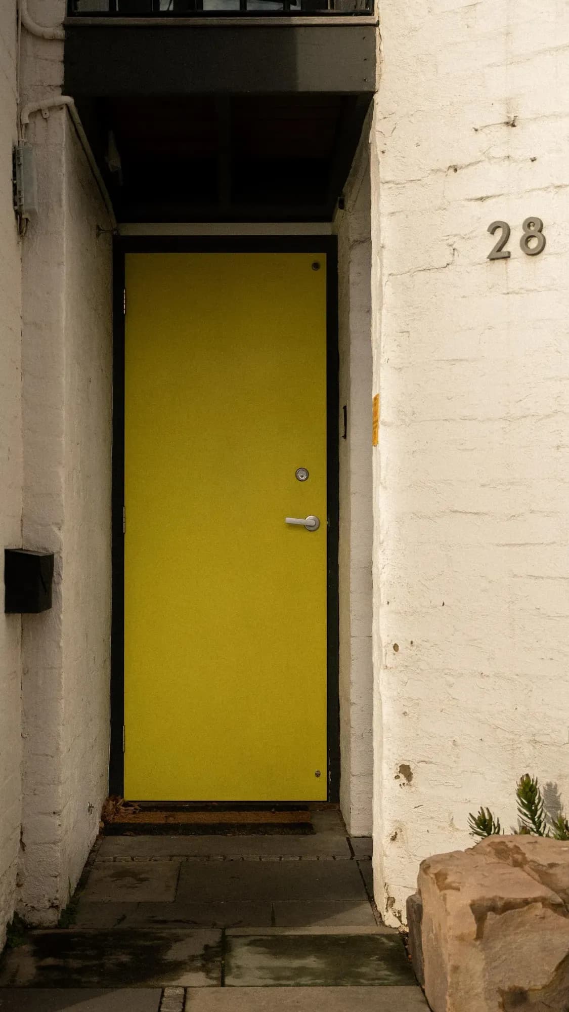 The entry looking through to the yellow door