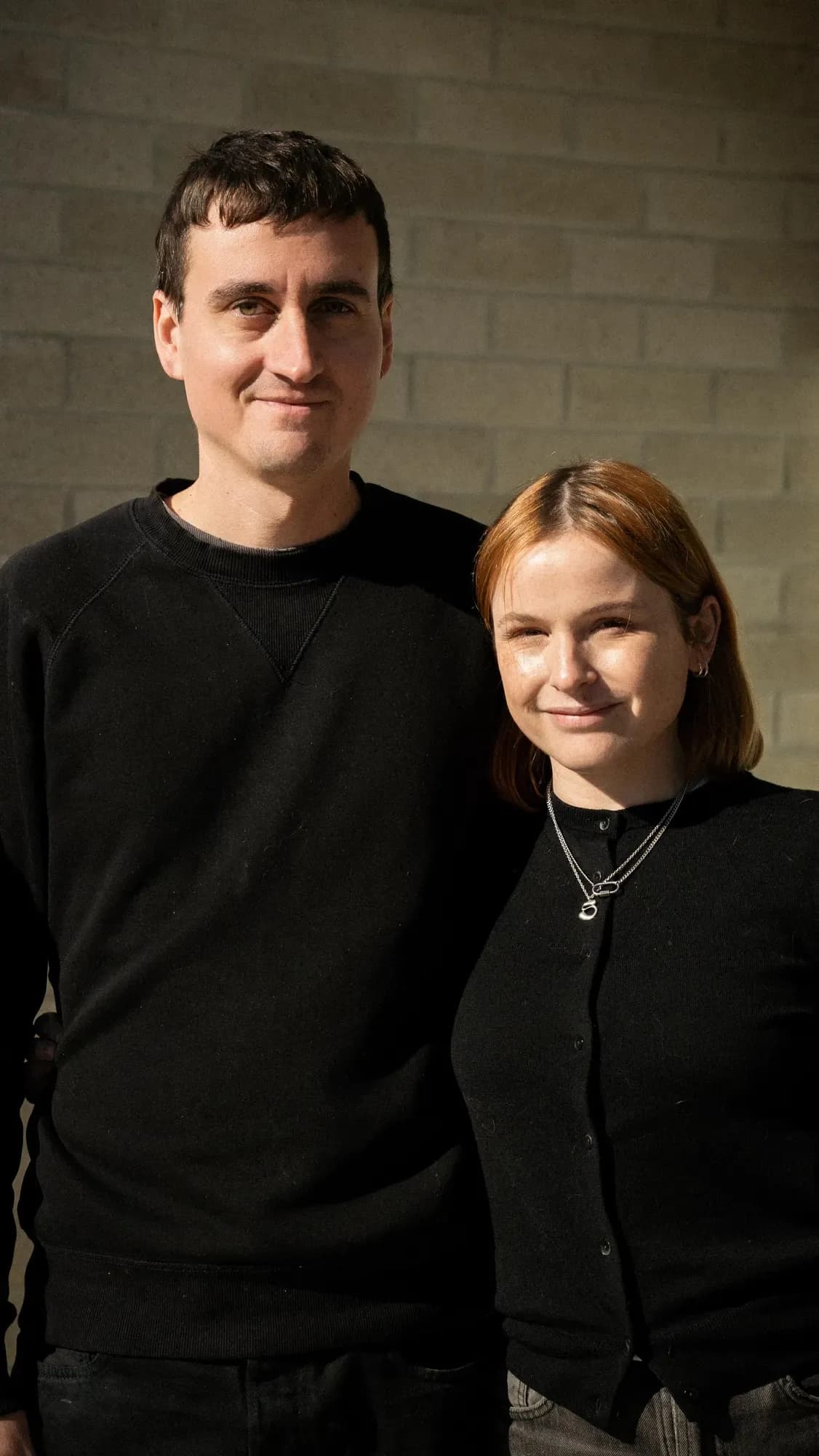 Claire and Sebastian outside their new home
